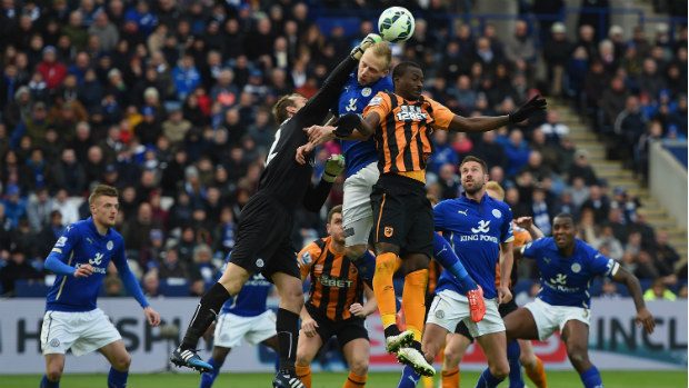 Mark Schwarzer flies high to get a fist to the ball for Leicester City.