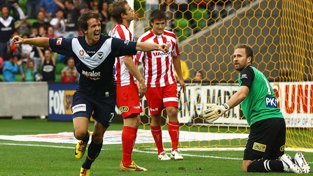 Robbie Kruse celebrates one of his two first-half goals for Victory in the Melbourne Derby.