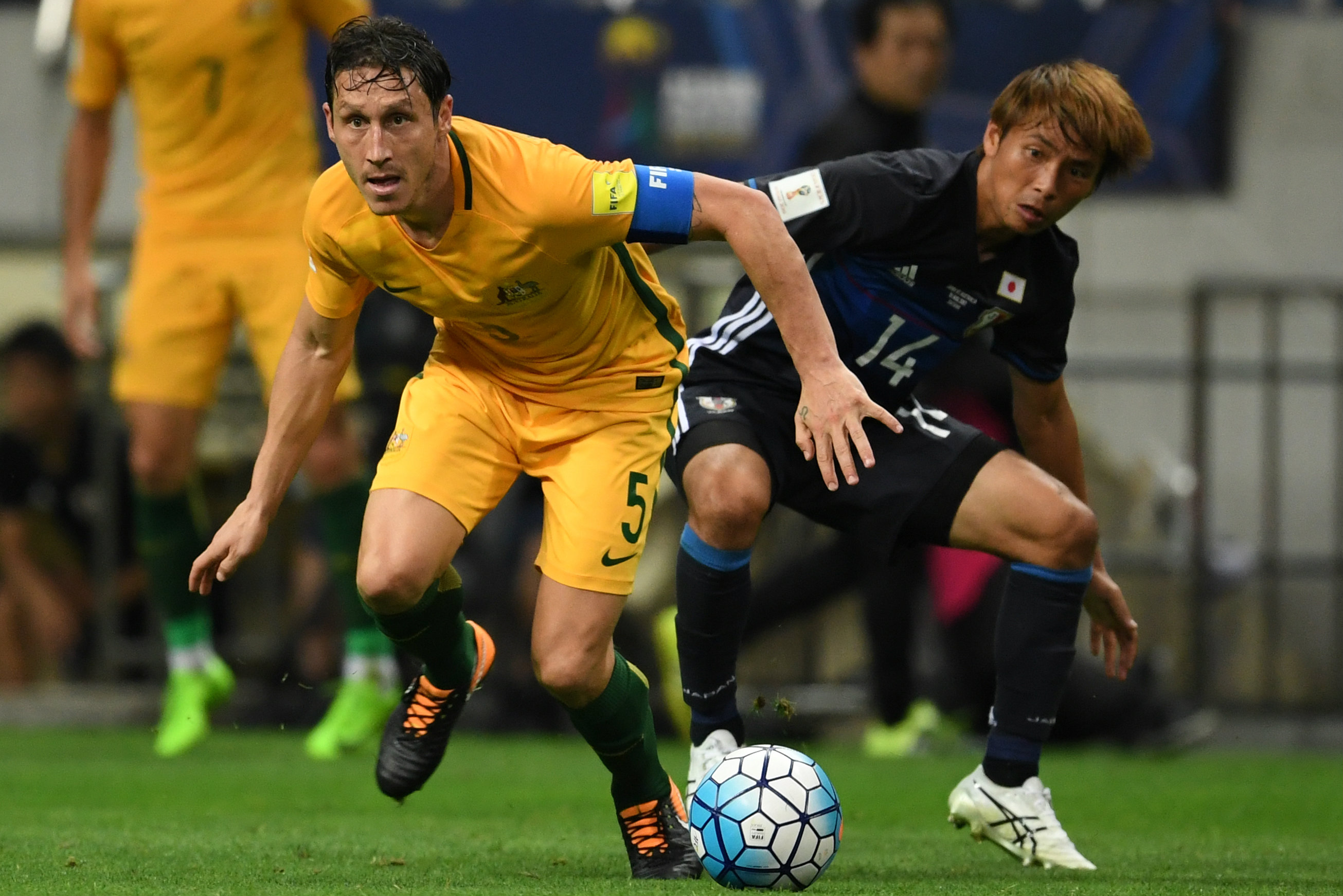 Mark Milligan on the ball against Japan.
