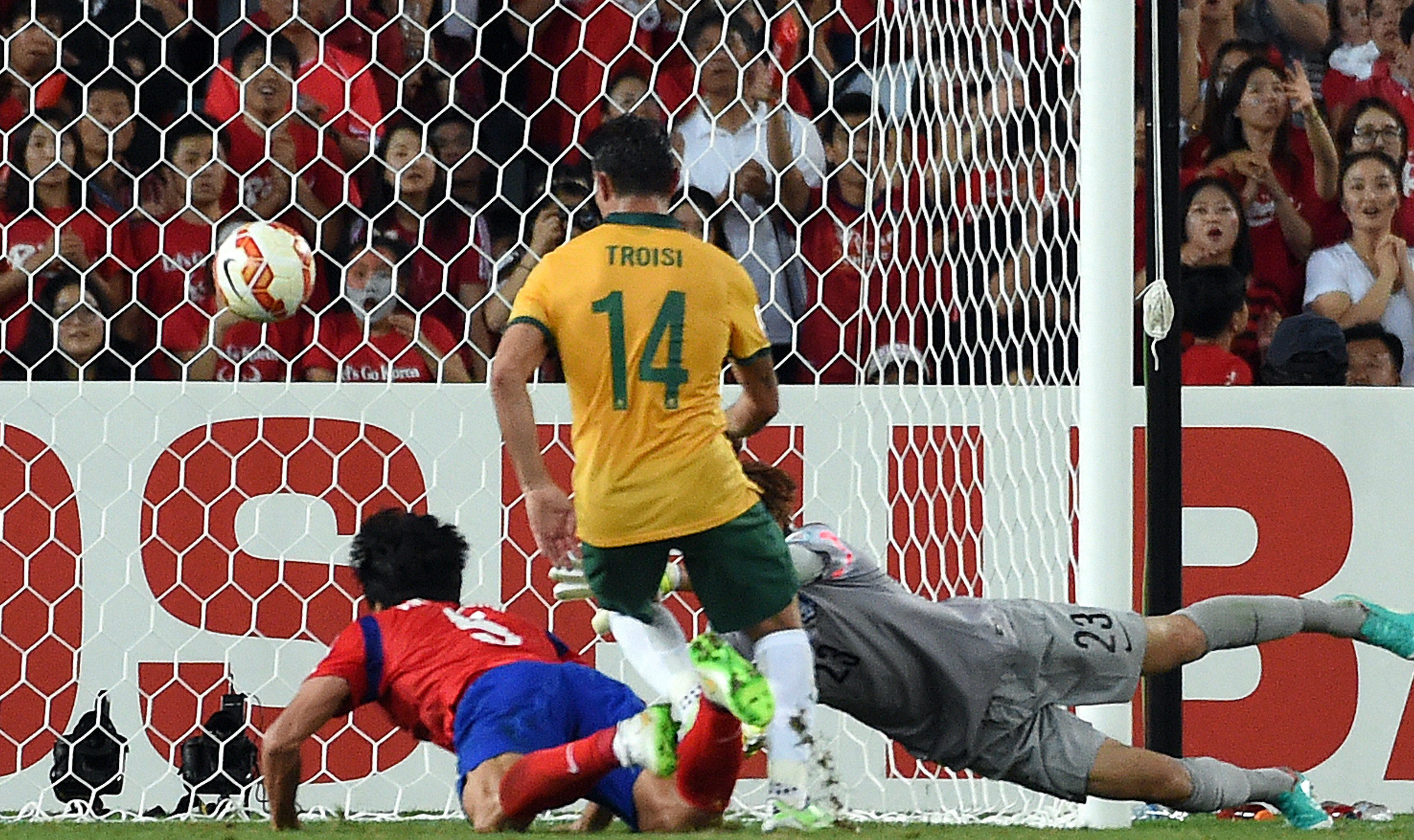 The moment. James Troisi sweeps home the winning goal against South Korea.