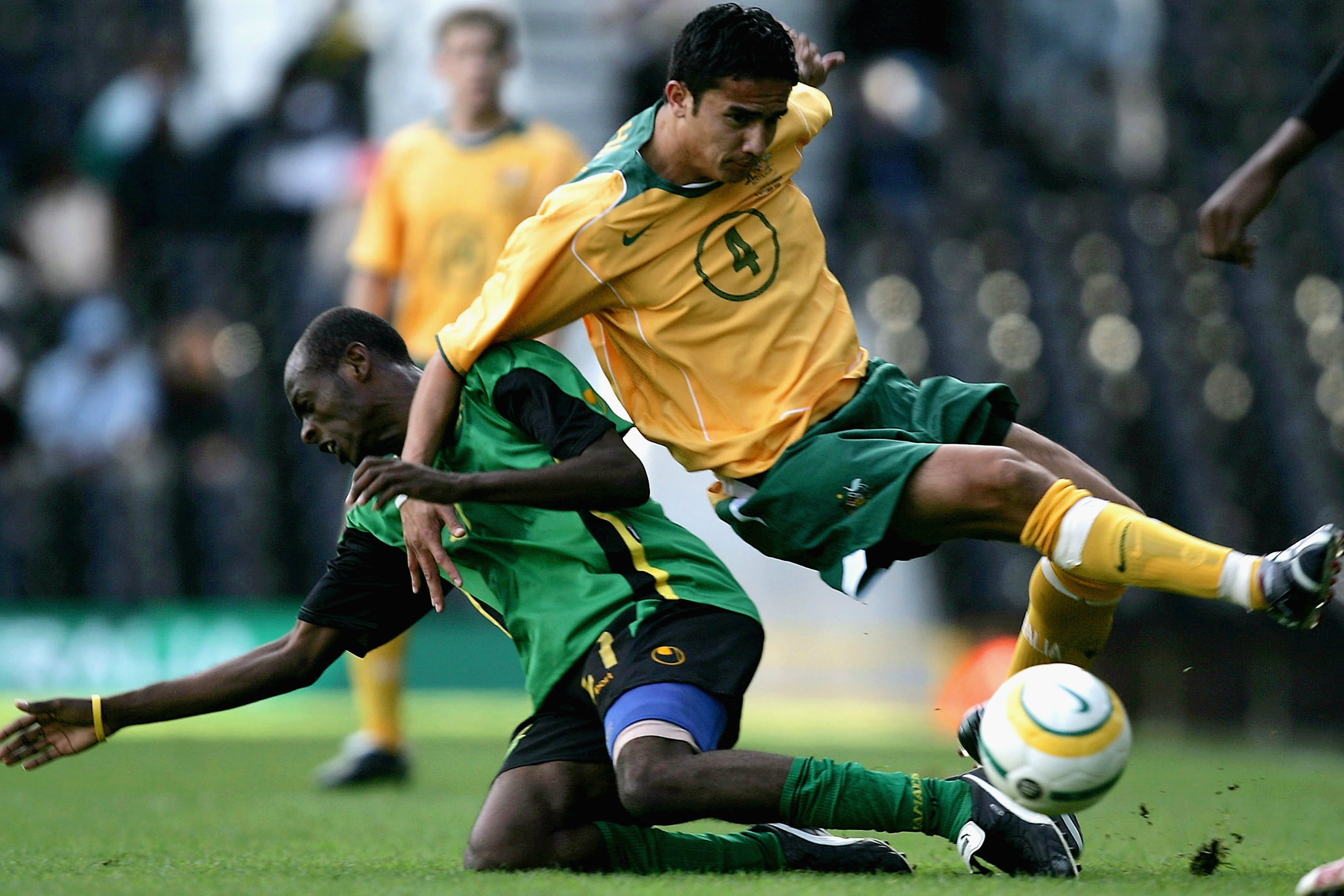 Tim Cahill cops a heavy challenge in Australia's big win over Jamaica in 2005.