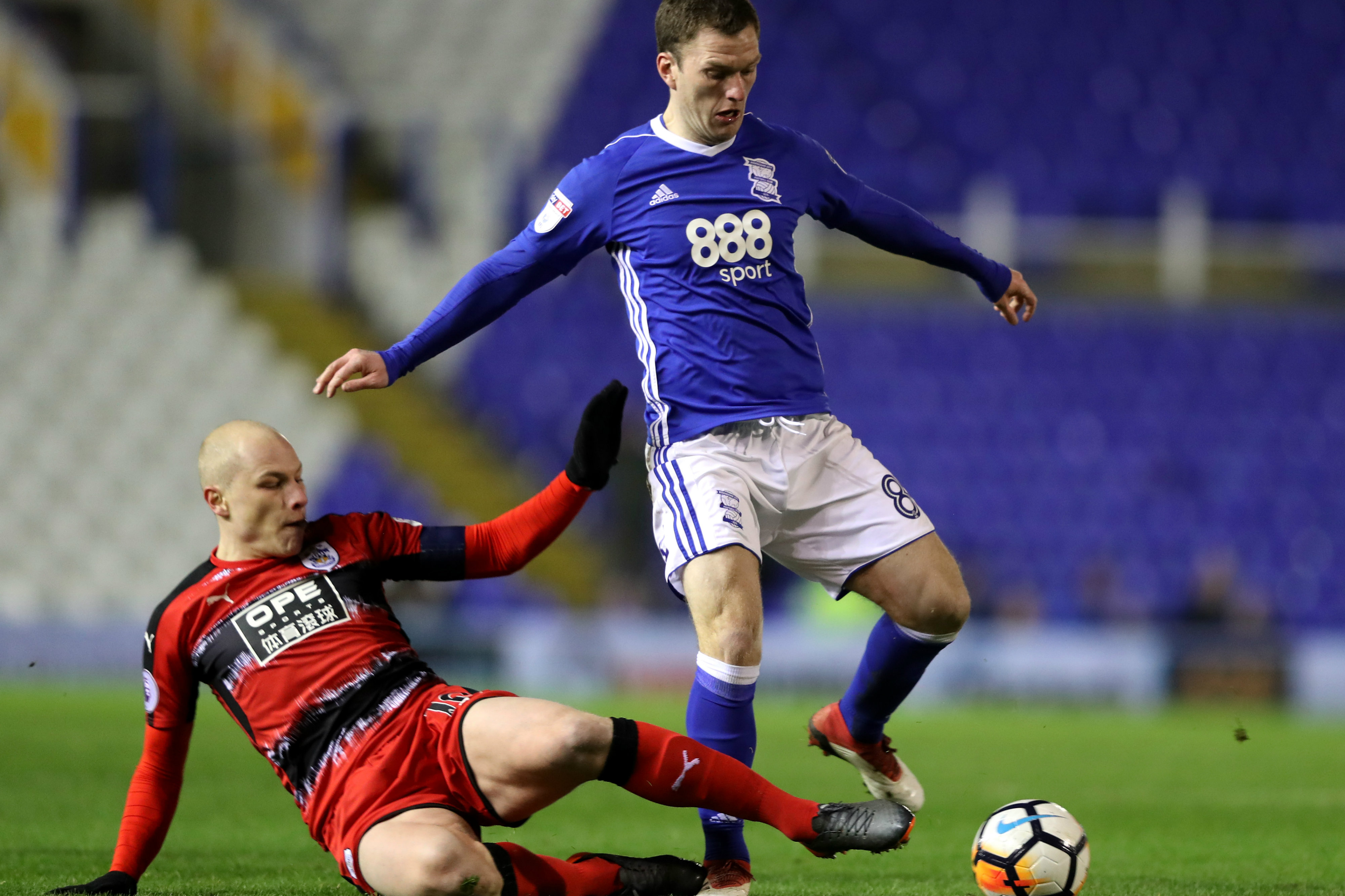 Aaron Mooy gets a tackle in on Birmingham's Craig Gardner.