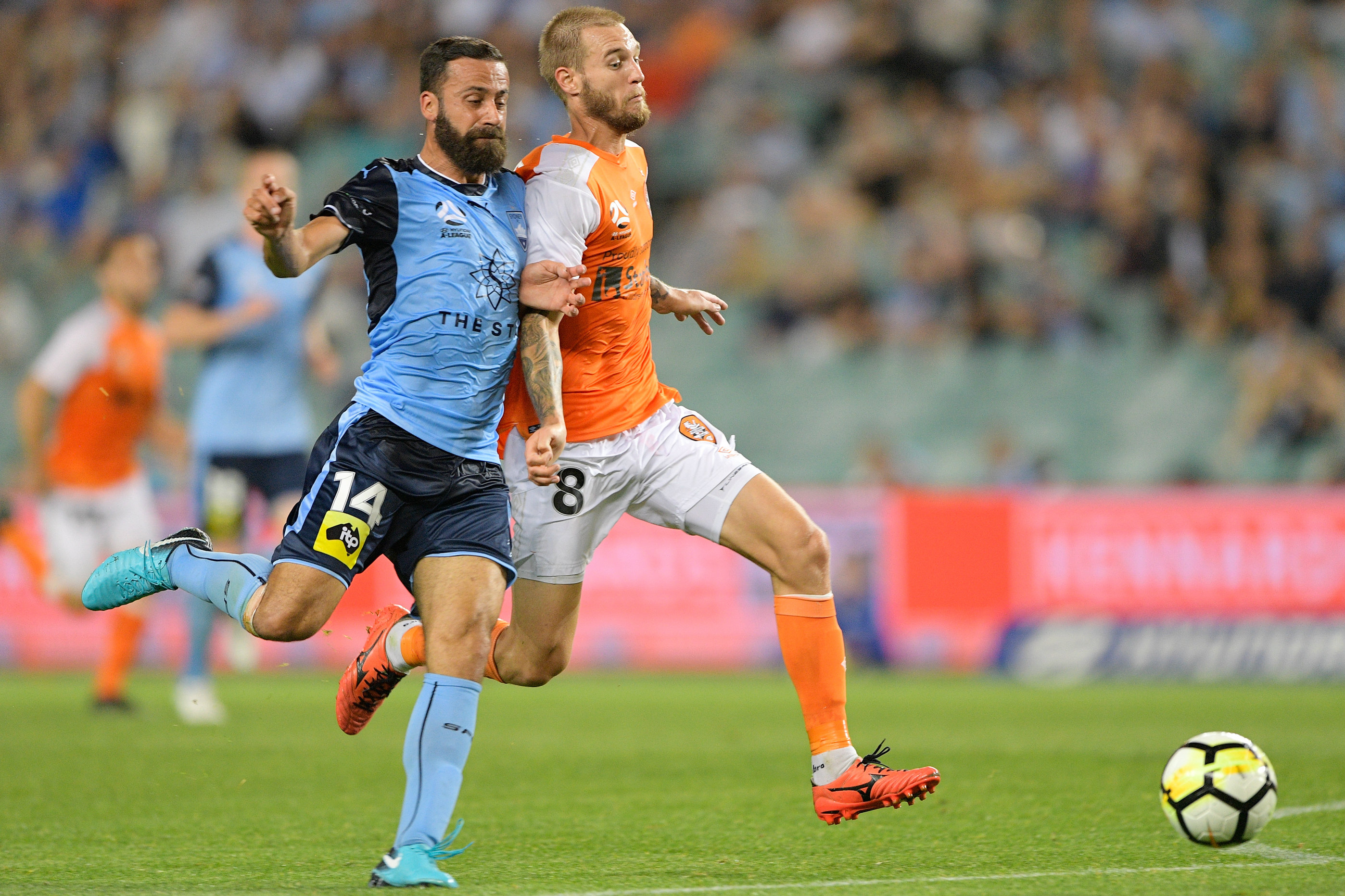Jacob Pepper in a battle for the ball with Sydney FC skipper Alex Brosque.