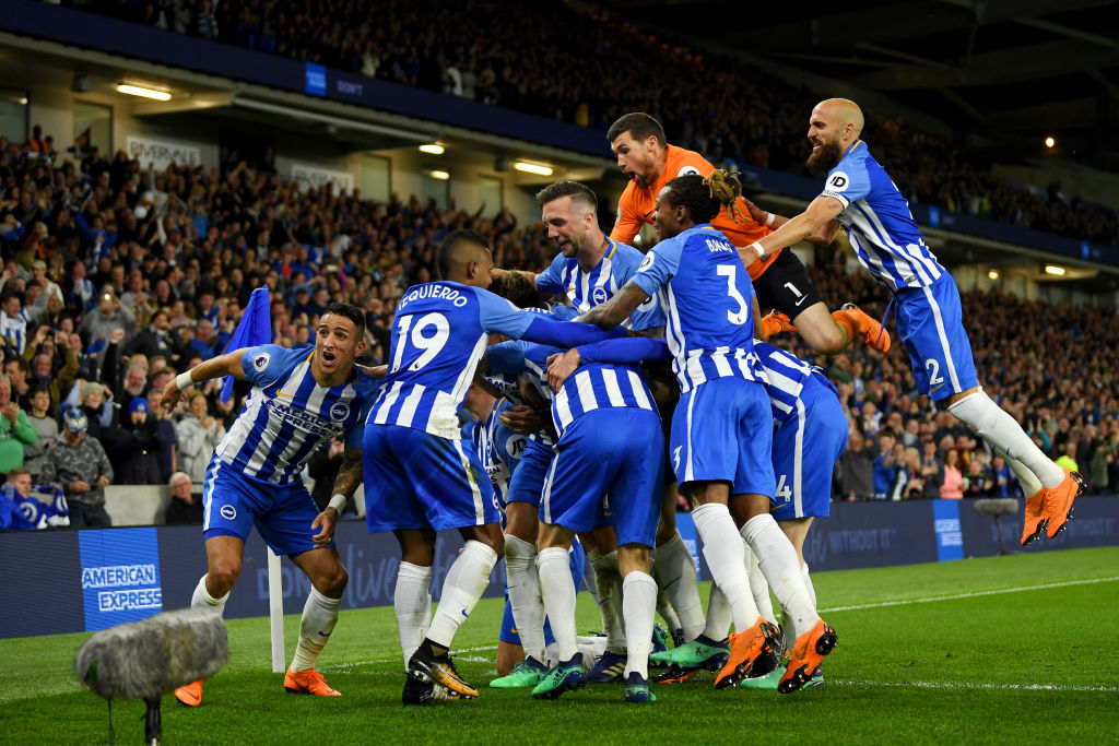 Mathew Ryan celebrates with his teammates after beating Manchester United