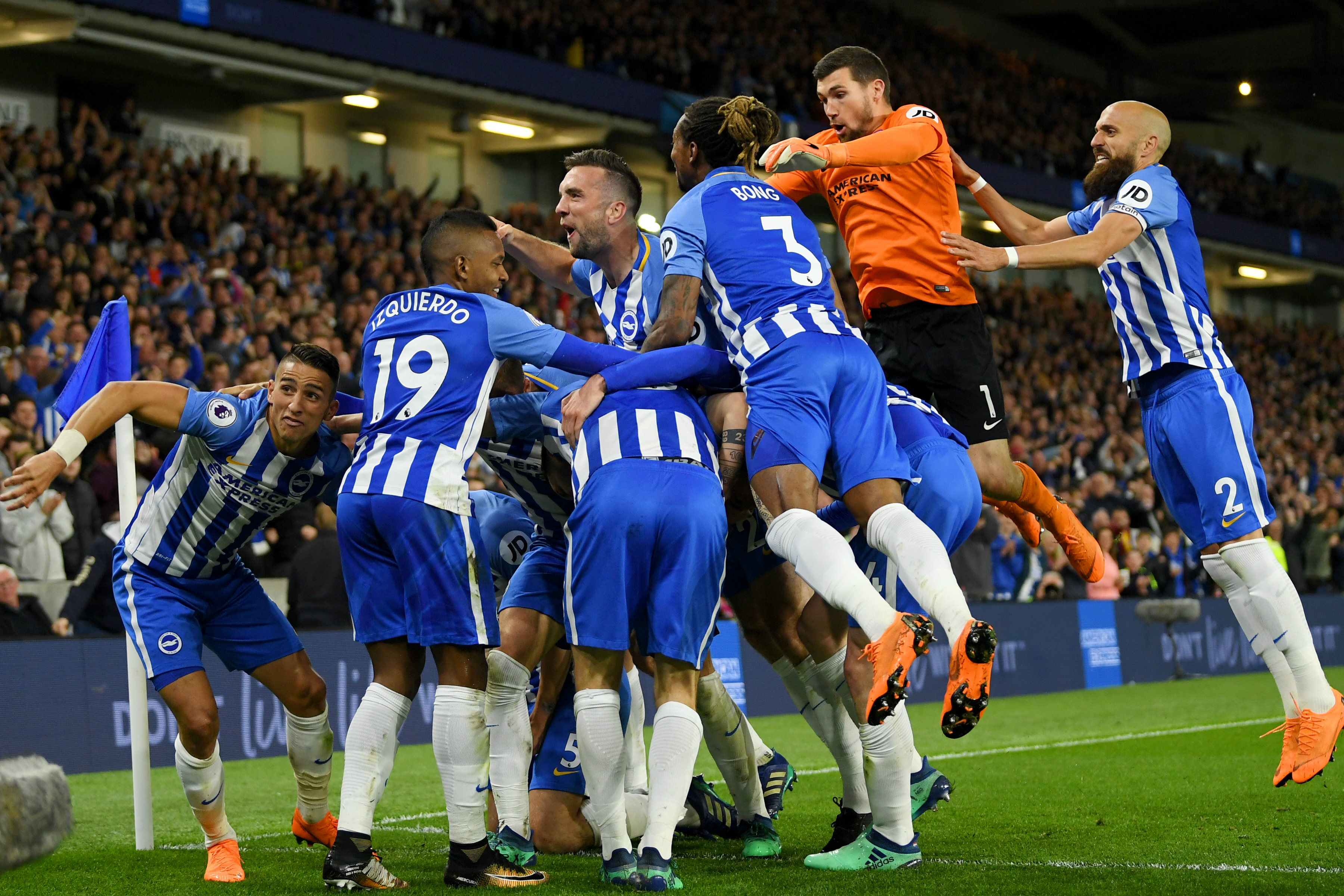 Brighton players celebrate Pascal Gross' winning goal.