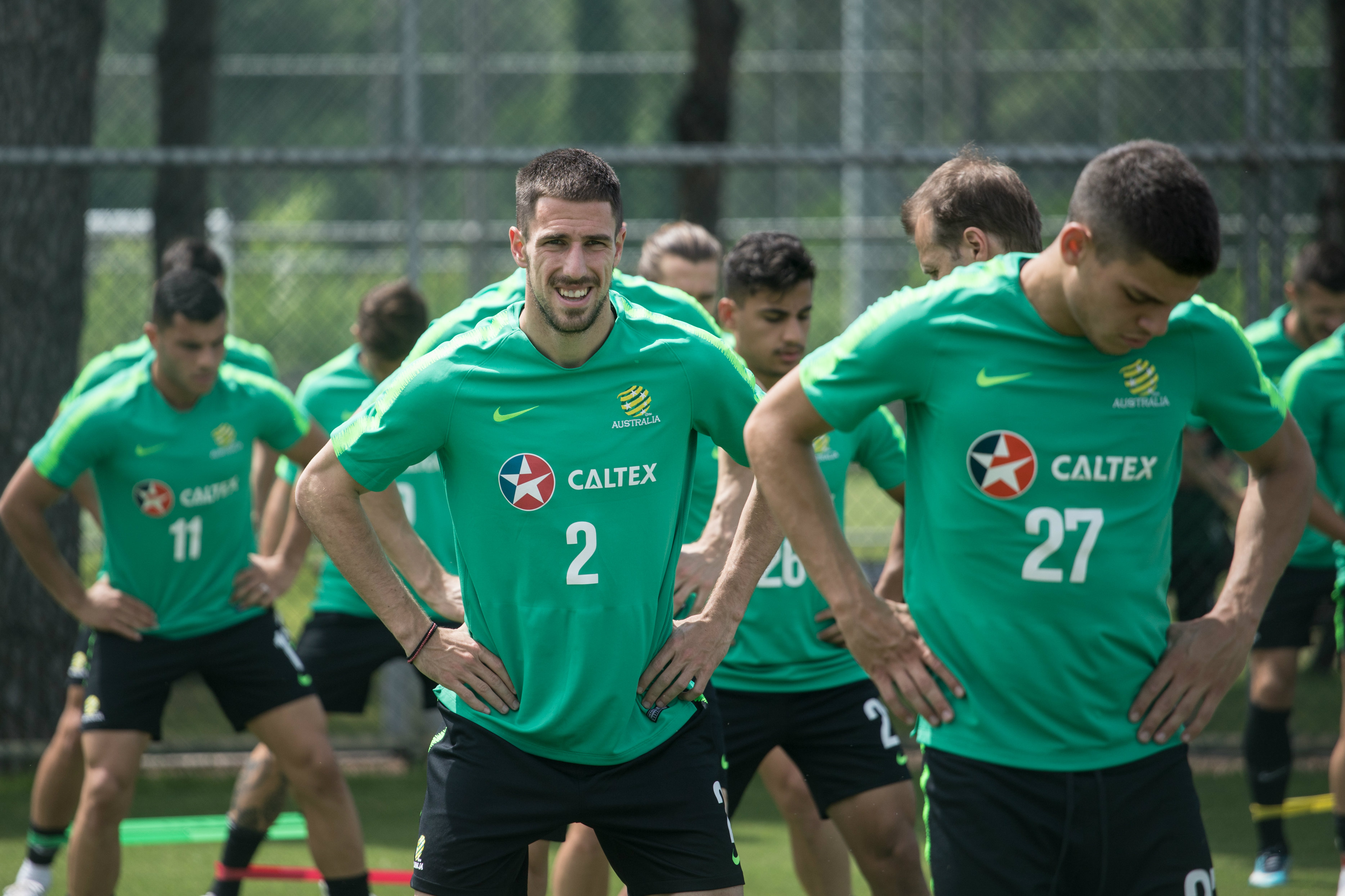 Milos Degenek going through some stretches.