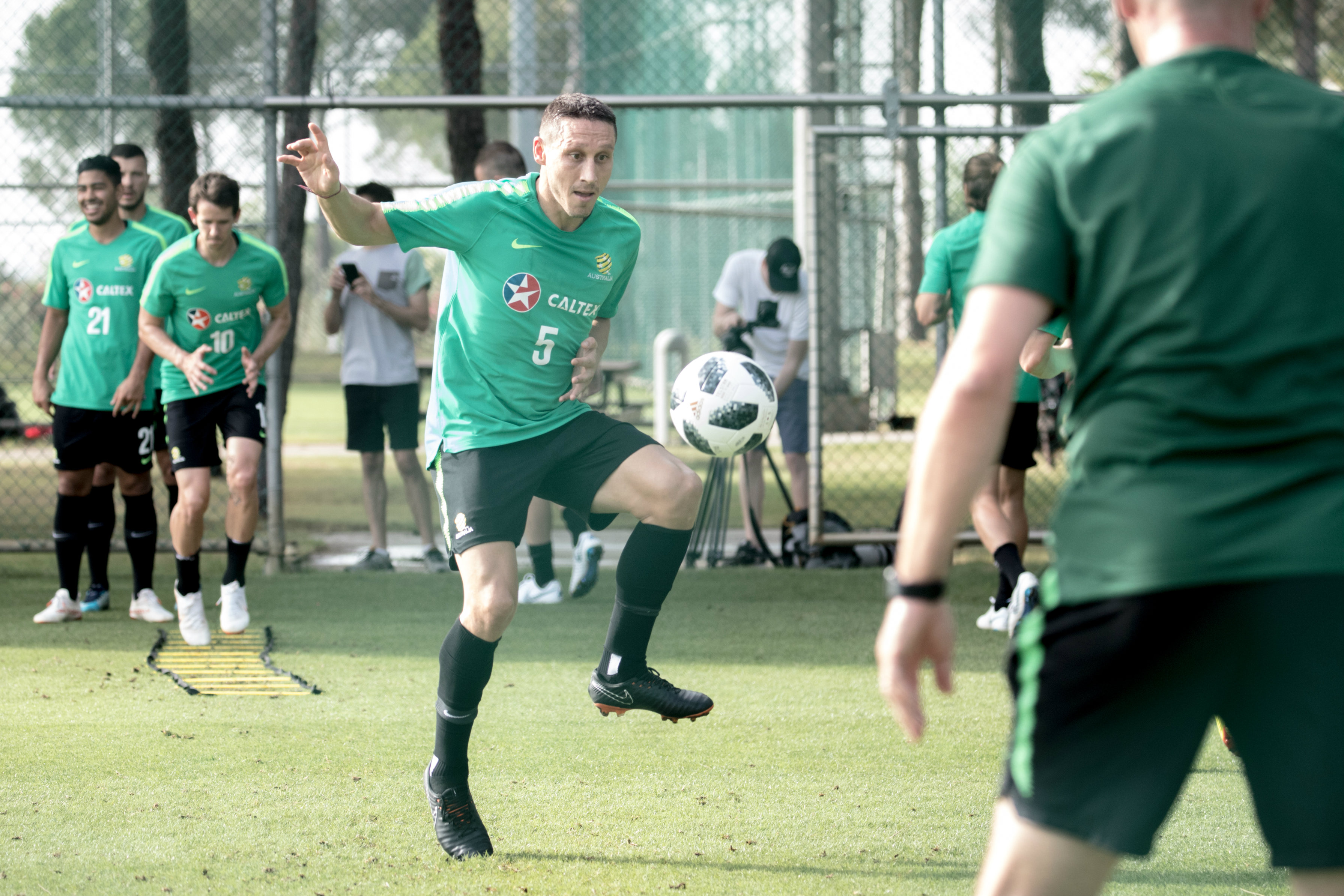 Mark Milligan with the side-foot volley.