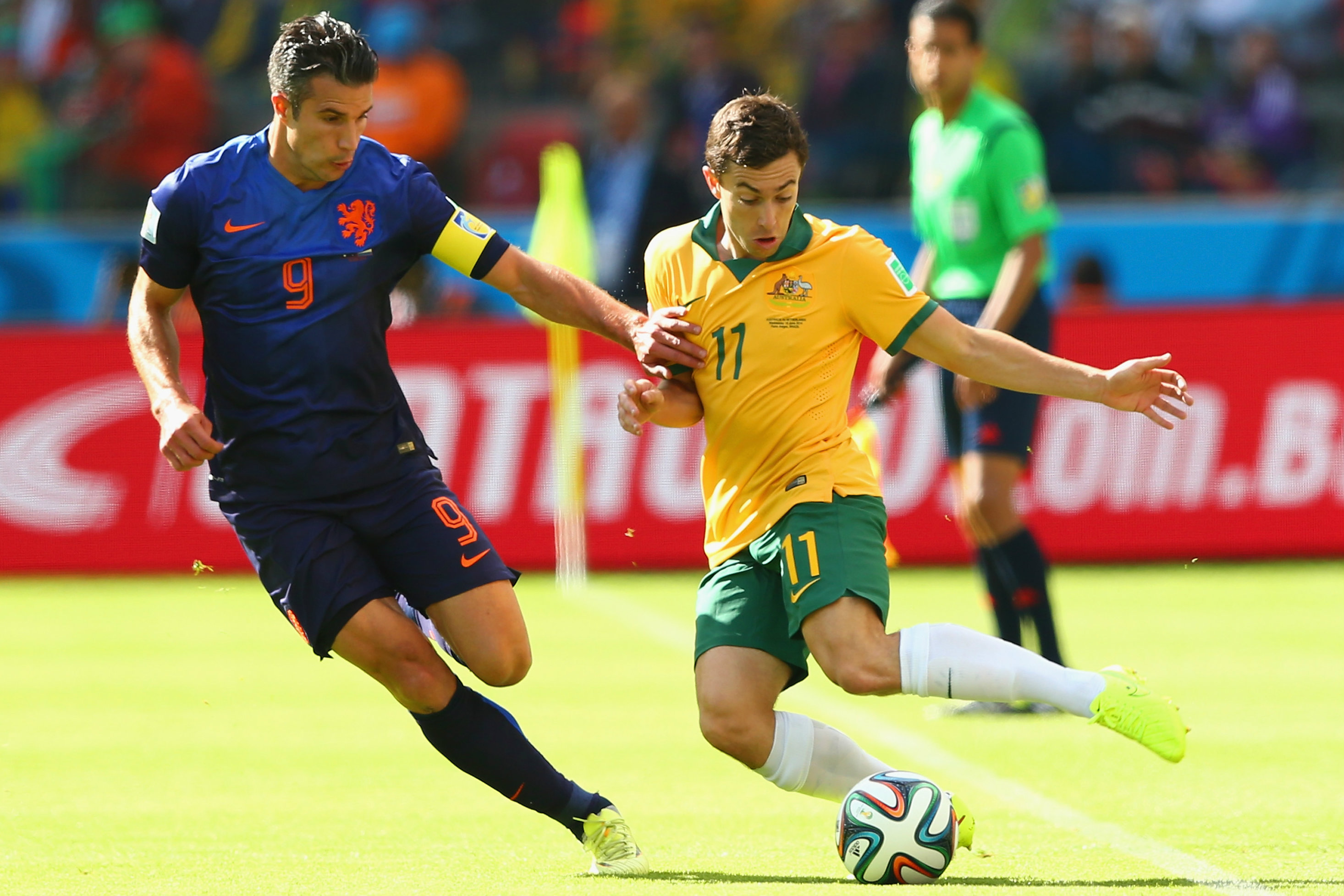 Oar goes up against the Netherlands' Robin van Persie in Porto Alegre. Oar goes up against the Netherlands' Robin van Persie in Porto Alegre.