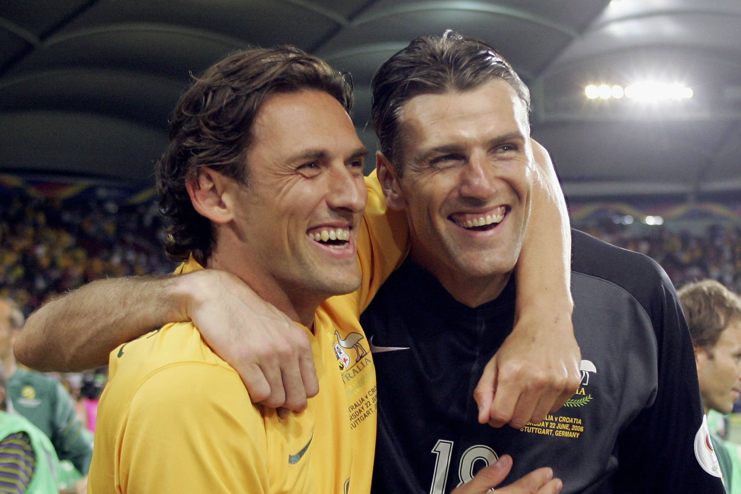 Tony Popovic and Zeljko Kalac celebrate after the draw against Croatia. Tony Popovic and Zeljko Kalac celebrate after the draw against Croatia.