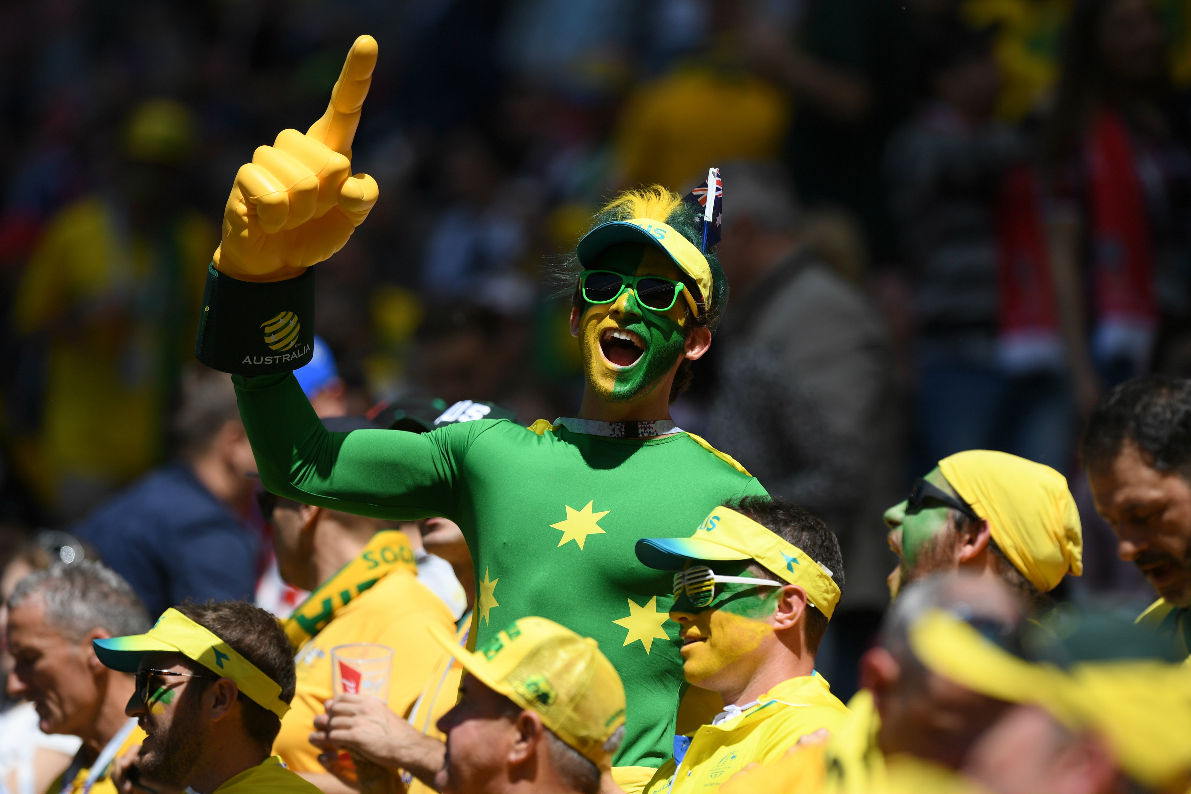 A Socceroos fan in full voice in Kazan.
