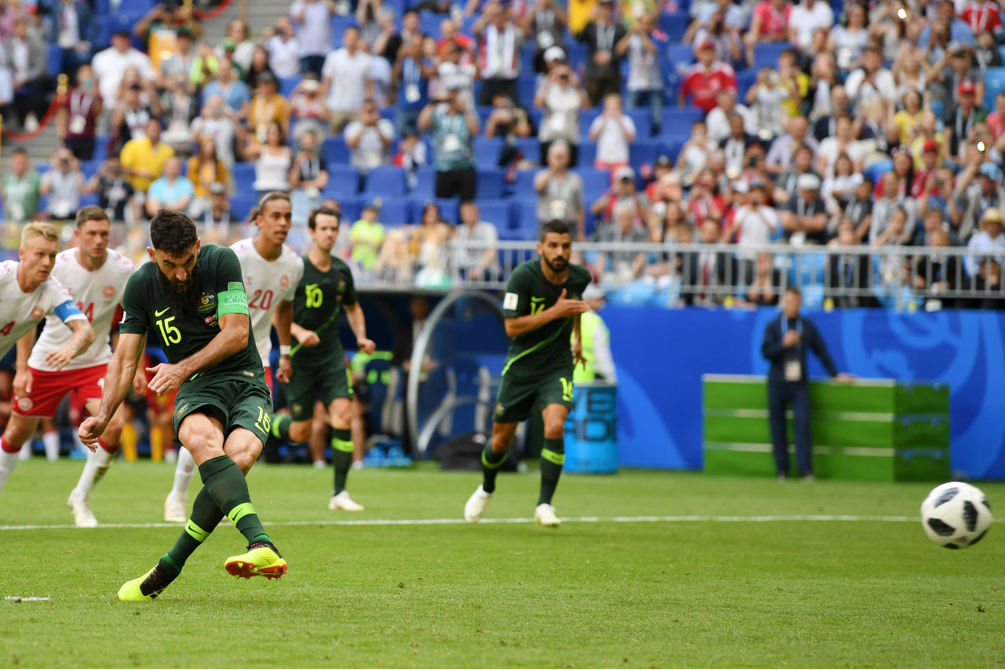 Mile Jedinak dispatches his penalty past Kasper Schmeichel.