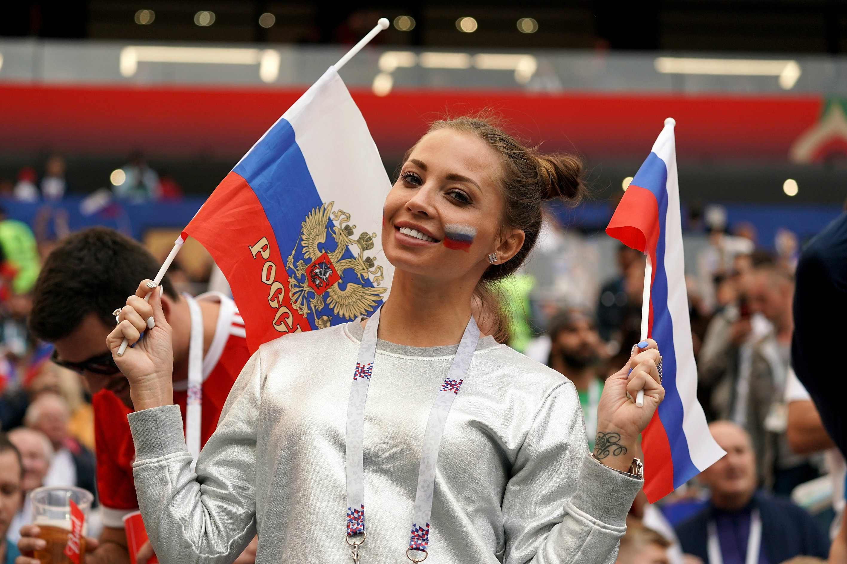 A Russian fan enjoys her team's big win over Saudi Arabia. A Russian fan enjoys her team's big win over Saudi Arabia.