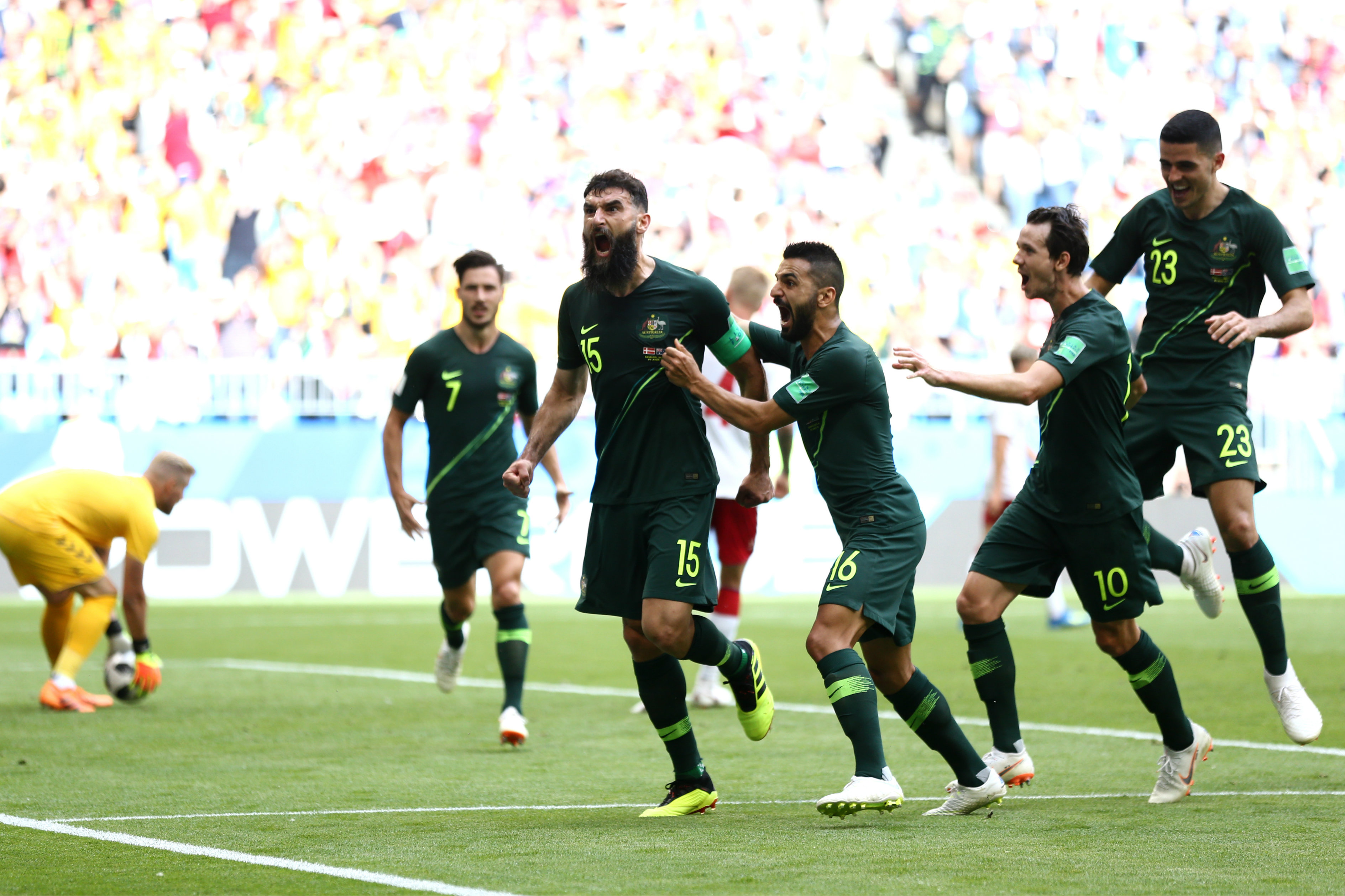 Mile Jedinak scores against Denmark. Mile Jedinak scores against Denmark.