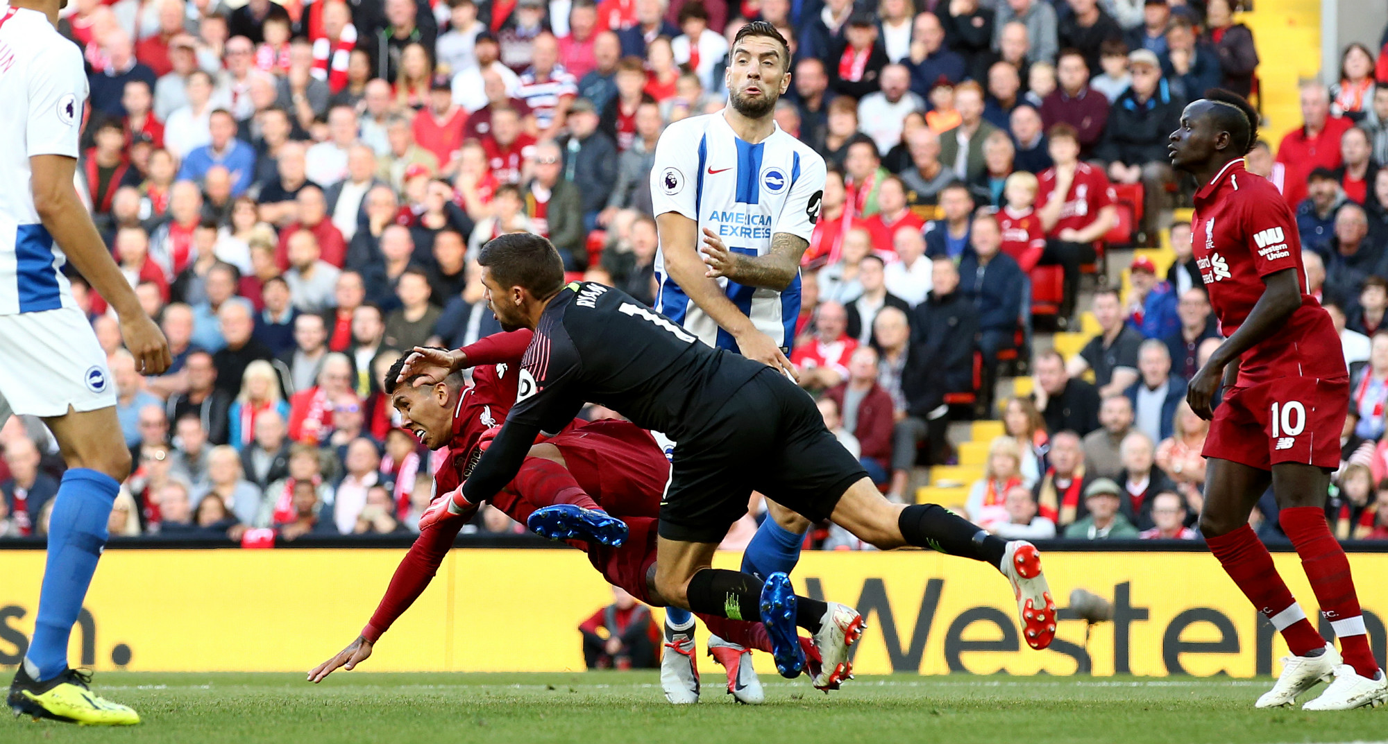 Ryan punches the ball against Liverpool