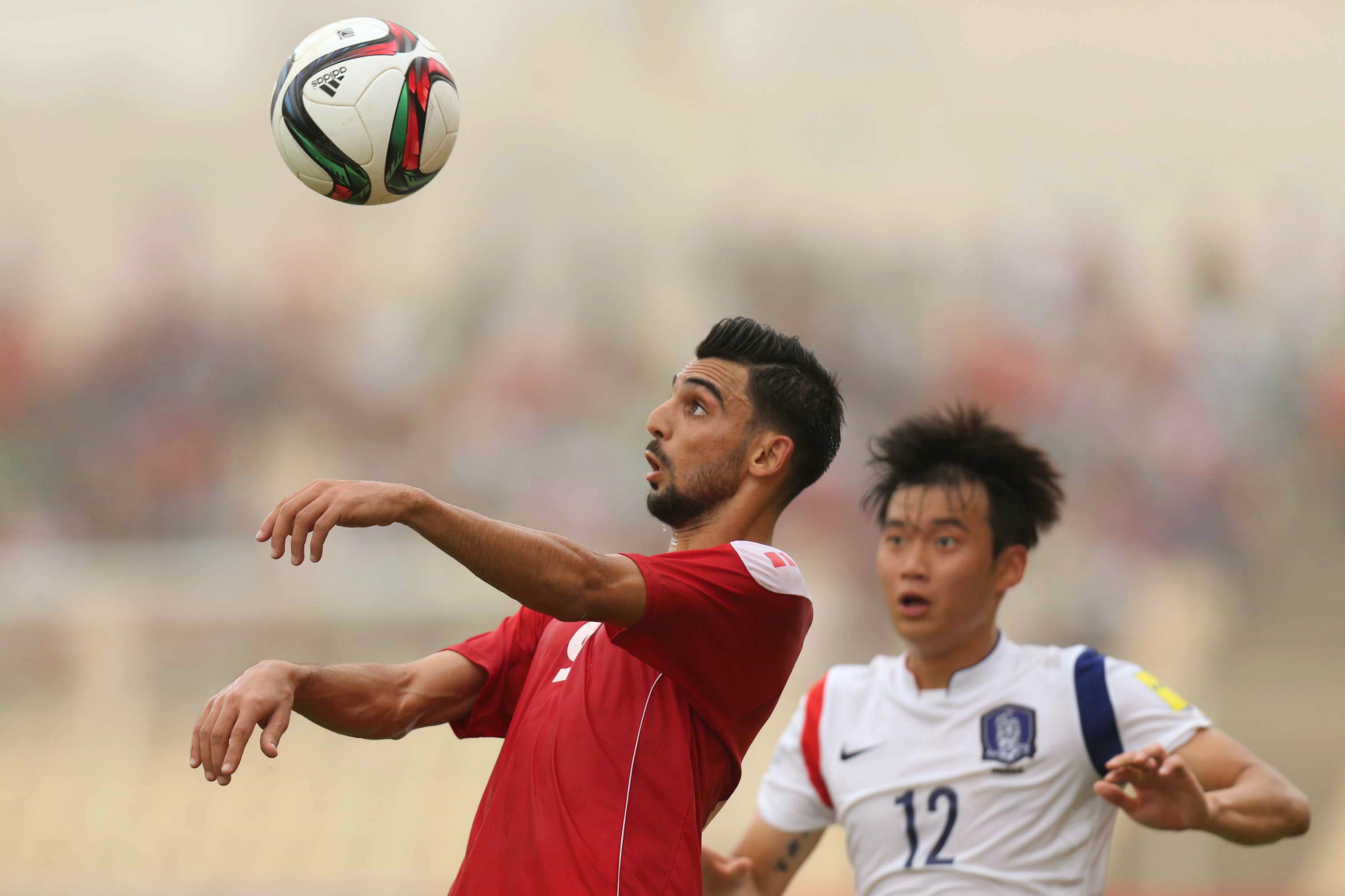 Mohamed Haider heads the ball against Korea Republic. Mohamed Haider heads the ball against Korea Republic.