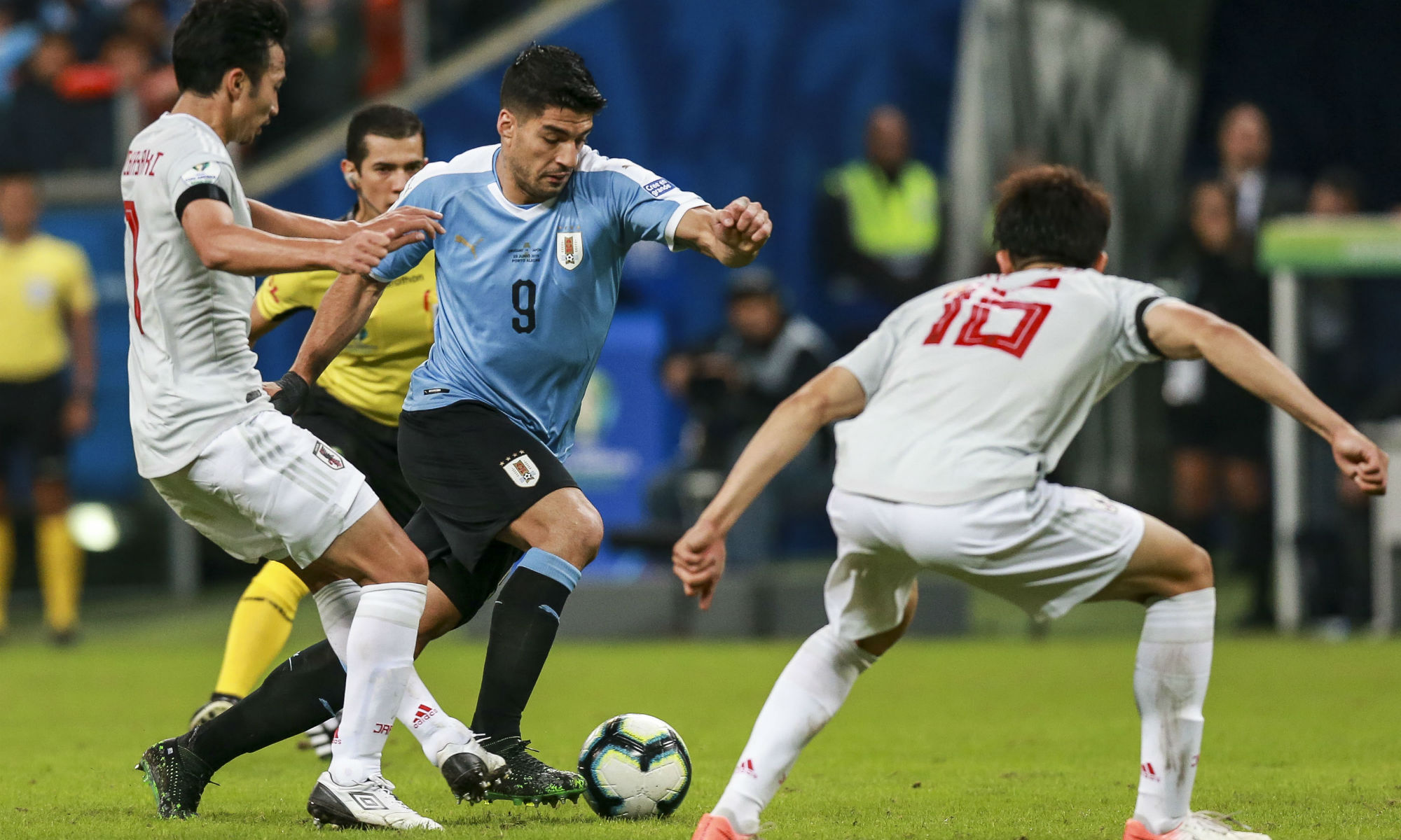 Uruguay's Luis Suarez takes on Japan's defence in the 2019 Copa America Uruguay's Luis Suarez takes on Japan's defence in the 2019 Copa America