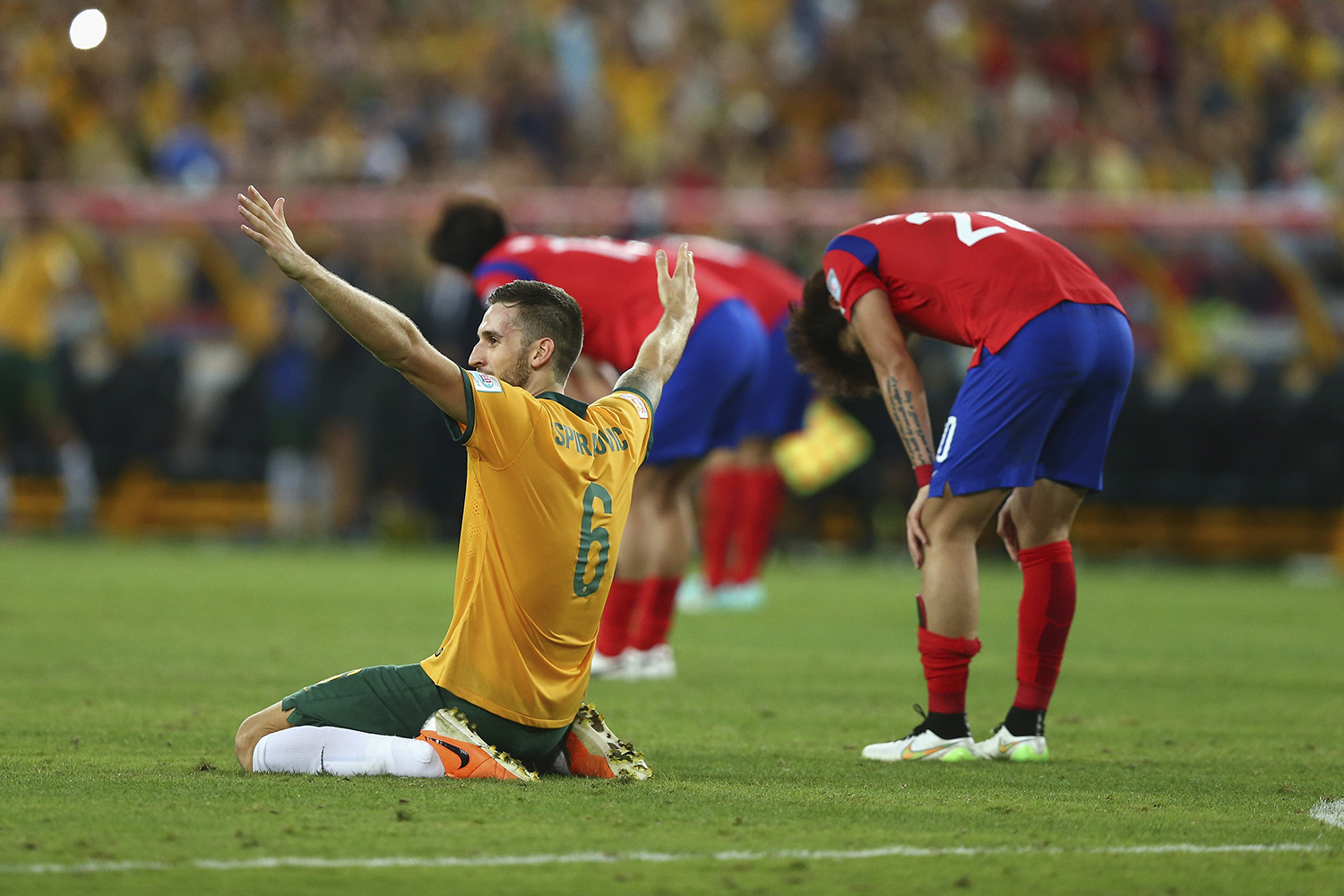 Matthew Spiranovic celebrates at full time after Australia defeated Korea Republic 2-1 to win the 2015 AFC Asian Cup