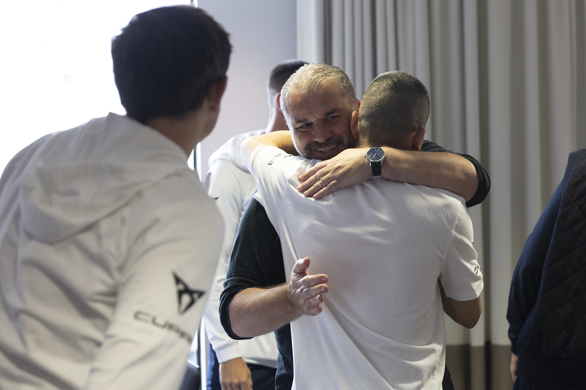 Ange Postecogolou hugs Aziz Behich