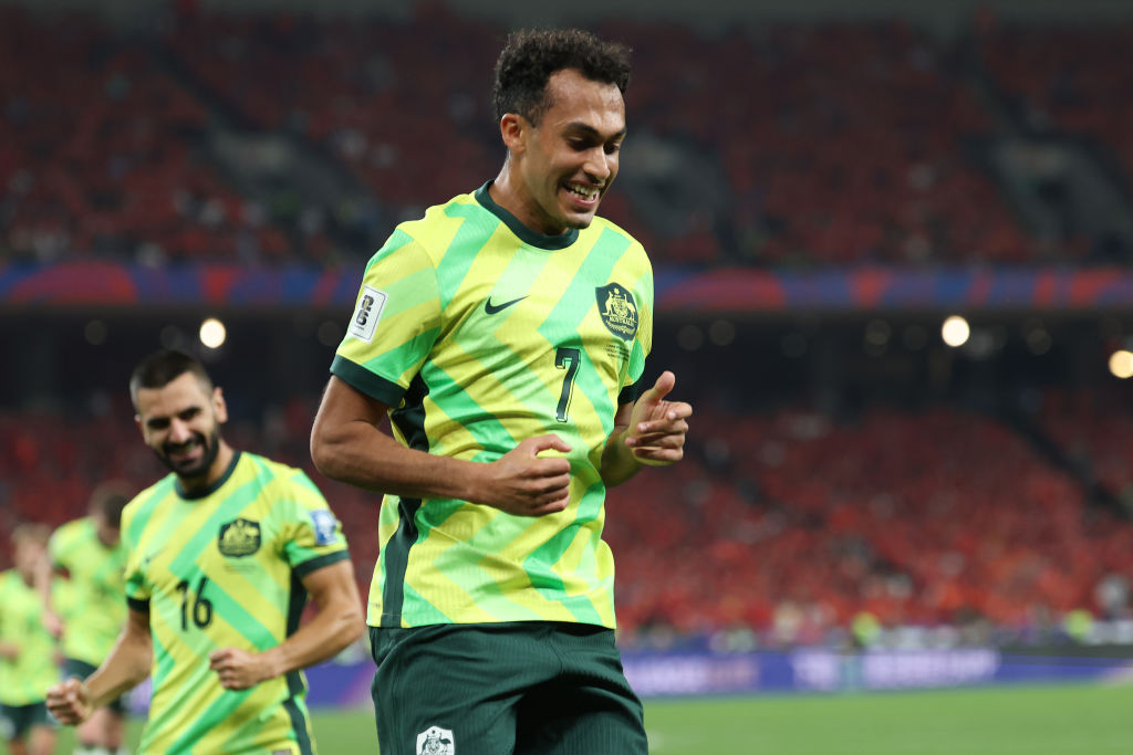 HANGZHOU, CHINA - MARCH 25: Nishan Velupillay of Australia celebrates after scoring the team's second goal during the FIFA World Cup Asian Qualifiers Group C match between China and Australia at Hangzhou Olympic Sports Centre Stadium on March 25, 2025 in Hangzhou, China. (Photo by Lintao Zhang/Getty Images)