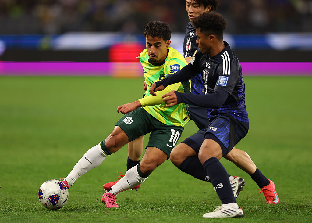 PERTH, AUSTRALIA - JUNE 05: Daniel Arzani of the Socceroos controls the ball against Joel Chima Fujita of Japan during the 2026 FIFA World Cup Round Three AFC Asian Qualifier match between Australia Socceroos and Japan at Optus Stadium on June 05, 2025 in Perth, Australia. (Photo by Paul Kane/Getty Images)