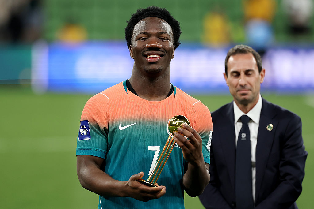 MELBOURNE, AUSTRALIA - MARCH 31: Nestory Irankunda of Australia poses with the player of the series trophy following the FIFA Series match between Australia Socceroos and Curacao at AAMI Park on March 31, 2026 in Melbourne, Australia. (Photo by Morgan Hancock - FIFA/FIFA via Getty Images)
