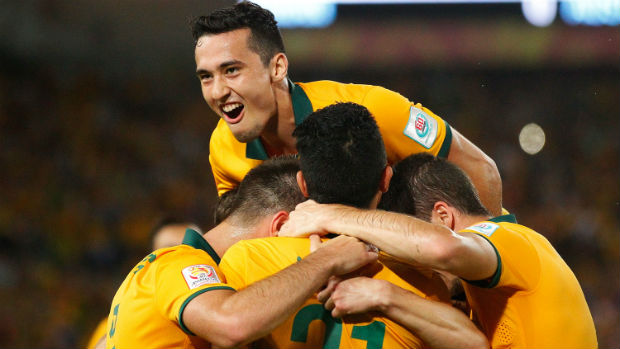 The Socceroos celebrate Robbie Kruse scoring against Oman.