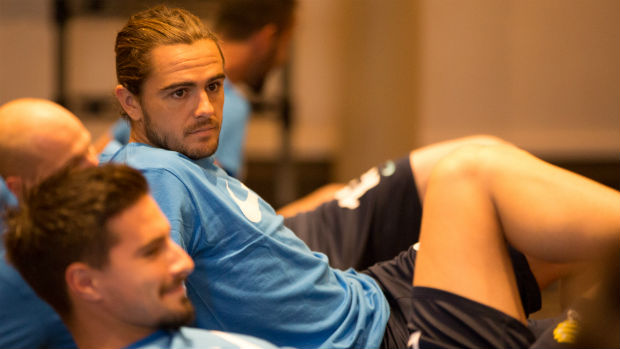 Caltex Socceroos defender Josh Risdon goes through his stretches in camp.