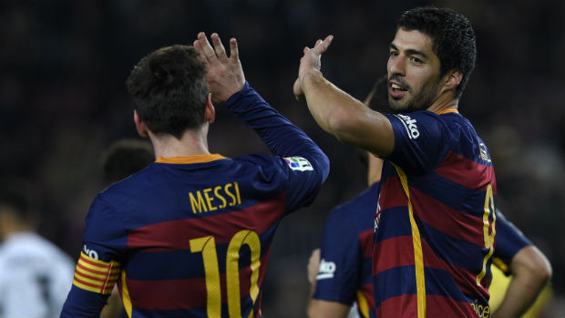 Barcelona's Lionel Messi and Luis Suarez celebrate scoring against Valencia in the first leg of their Copa del Rey semi-final.