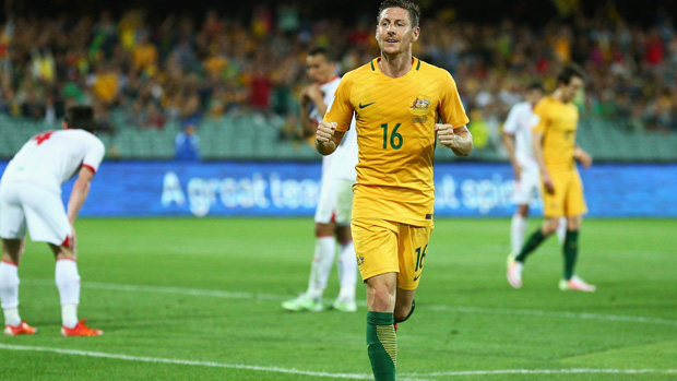 Nathan Burns celebrates after scoring against Tajikistan.