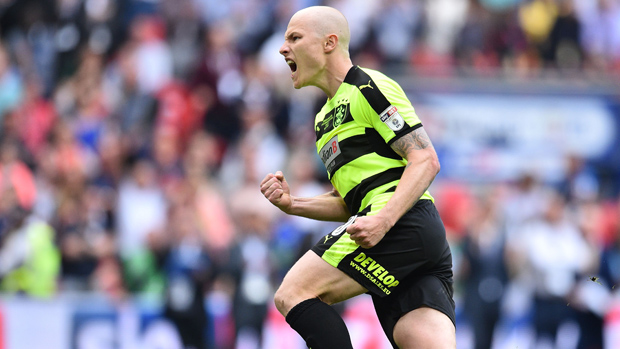 Aaron Mooy helped Huddersfield Town to a penalty shootout win over Reading in the Championship playoff.
