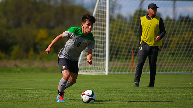 Joe Caletti at training with technical director Peter de Roo overseeing him