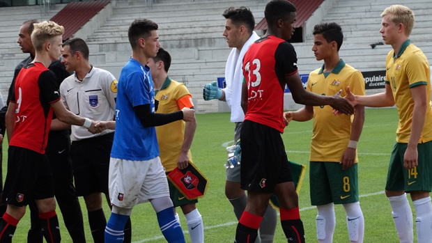 Joeys players shake hands with Stade Rennais players prior to kick off.
