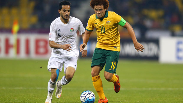 Olyroos skipper Mustafa Amini tries to break free from his Jordan marker.