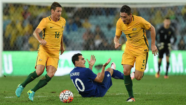 Mark Milligan goes on a darting run against Greece at ANZ Stadium on Saturday night.