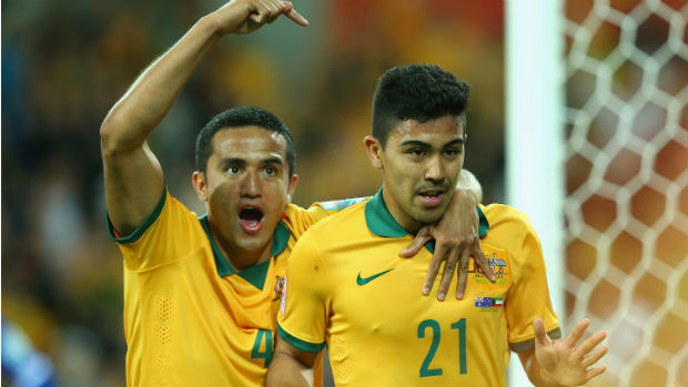 Tim Cahill and Massimo Luongo celebrate after combining to score for the Socceroos at the Asian Cup.