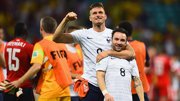 Olivier Giroud and Mathieu Valbuena of France celebrate after defeating Switzerland.