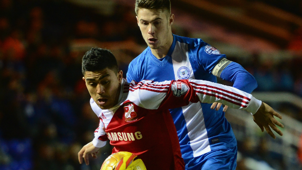 Socceroos midfielder Massimo Luongo on the ball for Swindon Town.