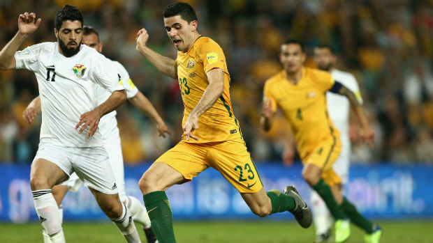 Tom Rogic unleashes a shot against Jordan at Allianz Stadium.