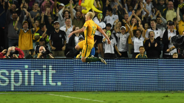 Midfielder Aaron Mooy celebrates getting on the scoresheet against Jordan in Sydney.