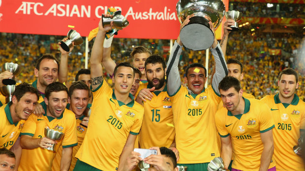 The Socceroos hold the Asian Cup aloft after clinching victory in the final.