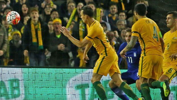 Trent Sainsbury scores against Greece the last time the Caltex Socceroos played in Melbourne.