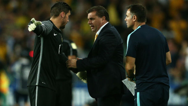Coach Ange Postecoglou passes on some instructions to goalkeeper Mat Ryan.