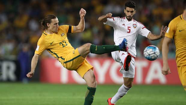 Jackson Irvine challenges for the ball with a UAE defender.