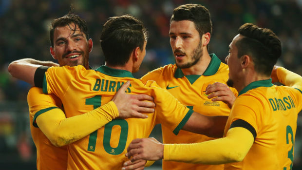 The Socceroos celebrate James Troisi's goal against Germany.
