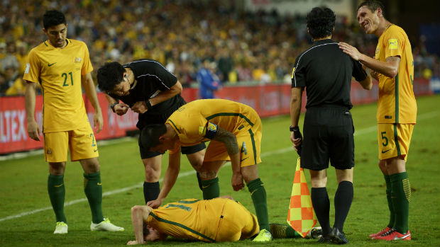 Robbie Kruse is injured by a horrific second-half challenge against Jordan.