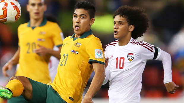 Luongo fights for the ball with UAE midfielder Omar Abdulrahman.