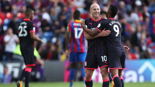 Aaron Mooy celebrates after Huddersfield Town's 3-0 win over Crystal Palace in the EPL opener.