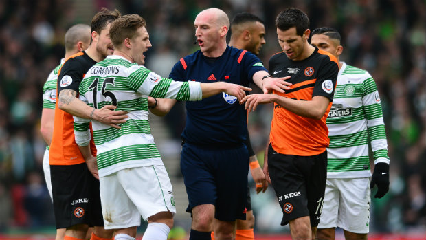 The referee separates Kris Commons and Ryan McGowan in the Scottish League Cup final.