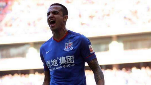 Striker Tim Cahill celebrates scoring for former club Shanghai Shenhua in the Chinese Super League.