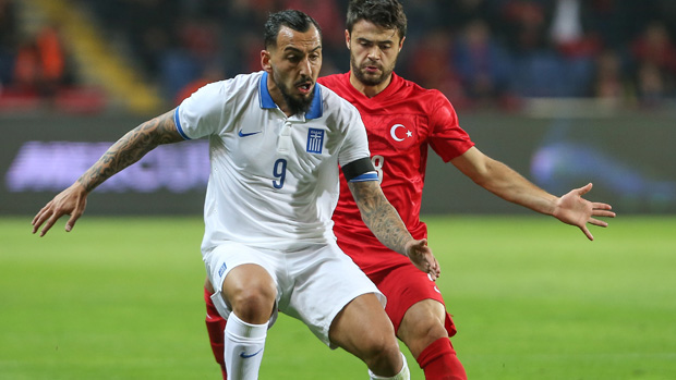 Benfica and Greek star Kostas Mitroglou on the ball in a friendly against Turkey.